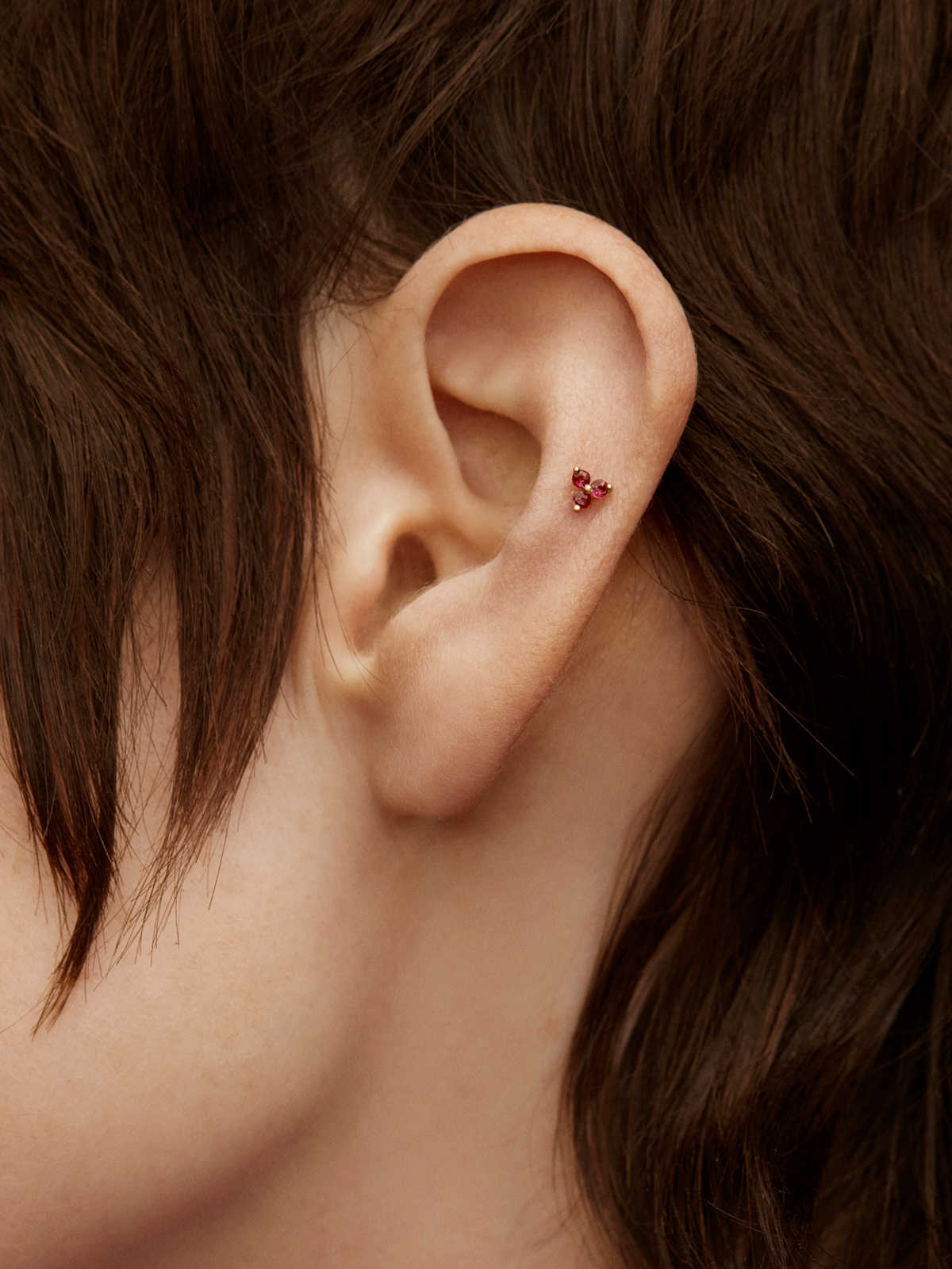 Individual 18K rose gold earring with rubies