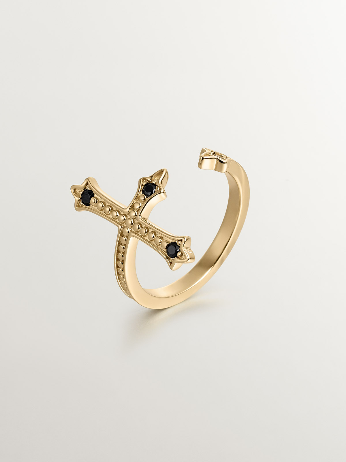You and Me ring made of 925 silver, bathed in 18K yellow gold, cross-shaped with black spinels.