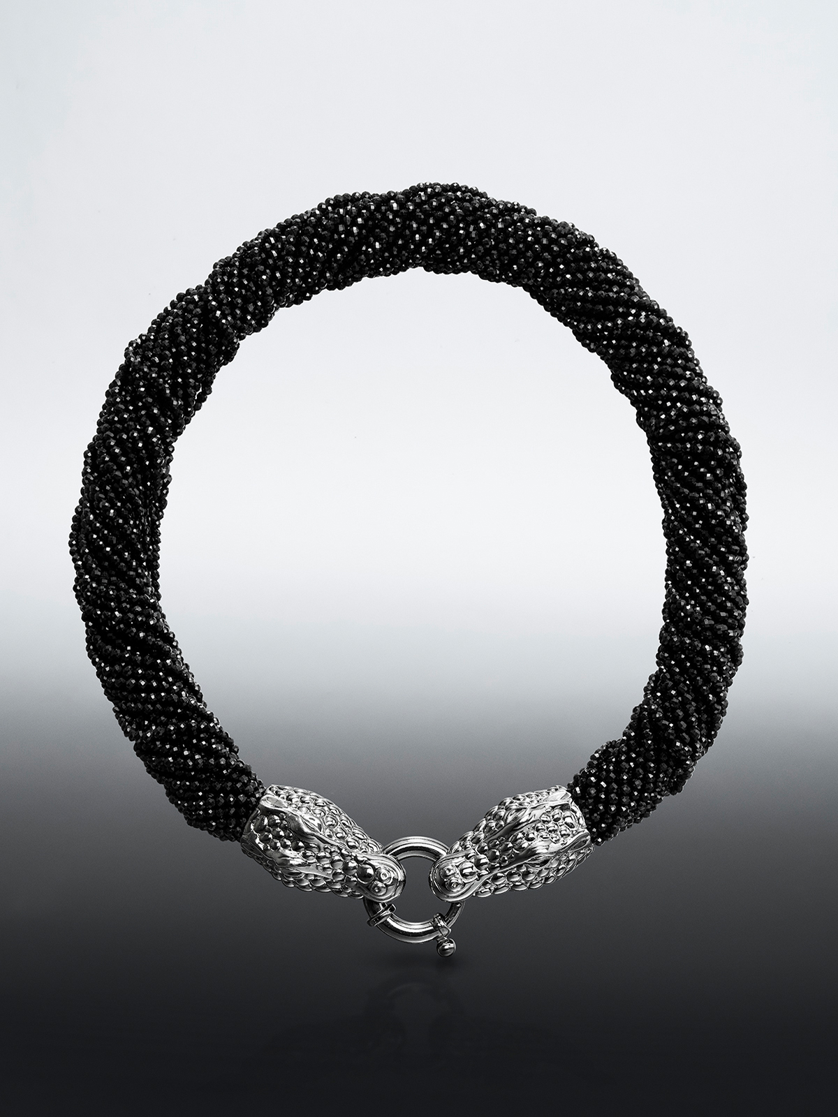 925 silver necklace shaped like crocodile and black spine.
