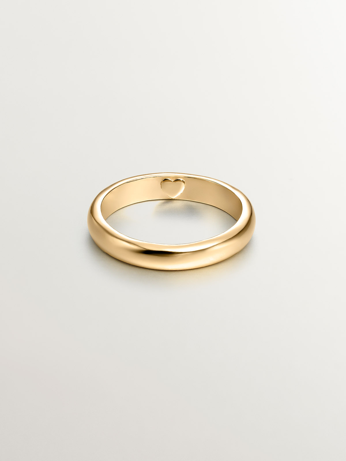 925 Silver band-style ring bathed in 18K yellow gold with an internal heart.